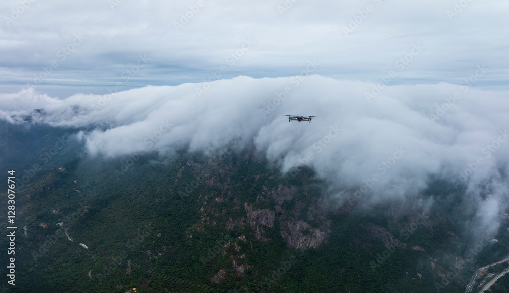 Obraz premium Drone Flying Kowloon Peak in Mist, Hong Kong