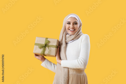 Young Muslim woman with gif...