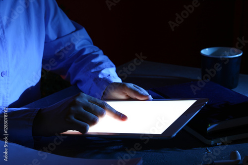 Person using digital tablet...