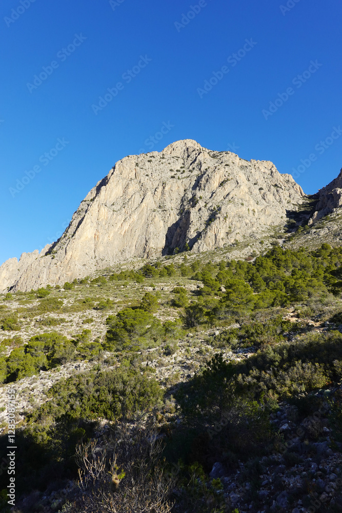 The mountain panorama opening from the hiking path to Puig Ca Campana, Finestrat, Spain The mountain panorama opening from the hiking path to Puig Ca Campana, Finestrat, Spain