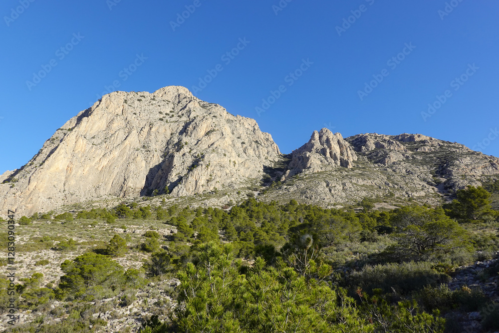 The mountain panorama opening from the hiking path to Puig Ca Campana, Finestrat, Spain The mountain panorama opening from the hiking path to Puig Ca Campana, Finestrat, Spain