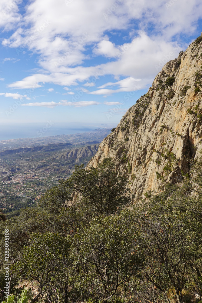 The mountain panorama opening from the hiking path to Puig Ca Campana, Finestrat, Spain The mountain panorama opening from the hiking path to Puig Ca Campana, Finestrat, Spain