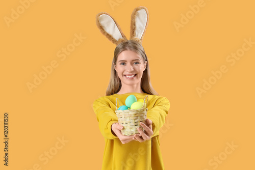 Young woman in bunny ears w...