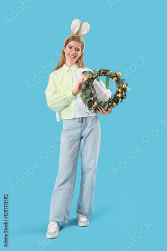 Young woman in bunny ears w...