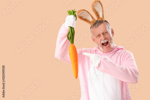 Senior man in Easter bunny ...