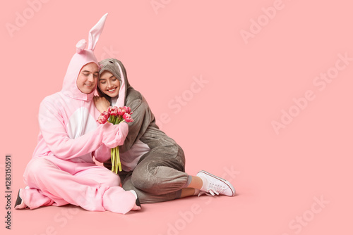 Happy young couple in bunny...