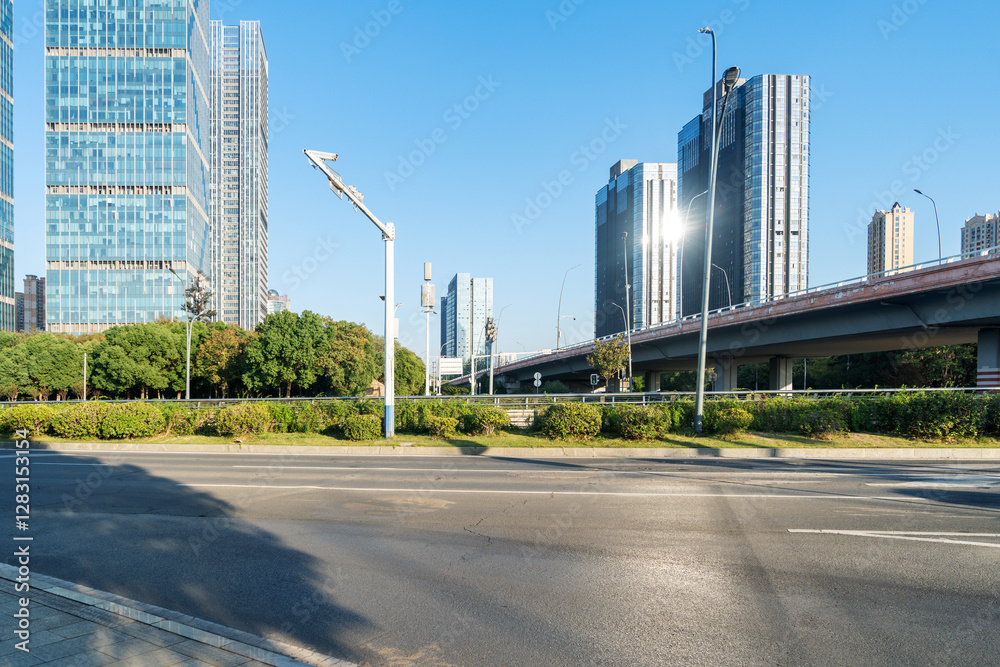 Fototapeta premium Empty urban road and buildings in the city
