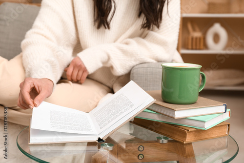 Woman relaxing at home read...