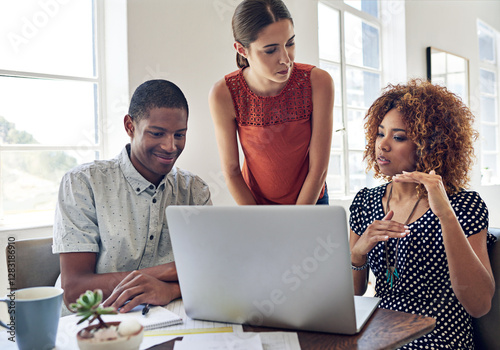 Canvas Print Discussion, laptop and people in startup for graphic design, meeting and collaboration