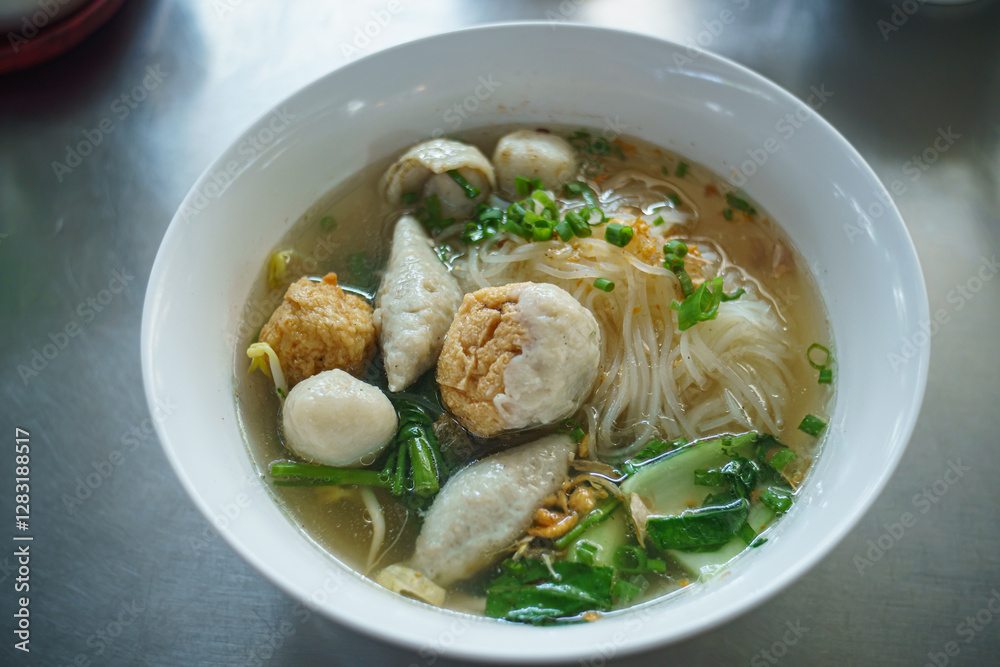 Fish line in white bowl, Fish ball noodle soup recipe. Top view Fish line in white bowl, Fish ball noodle soup recipe. Top view