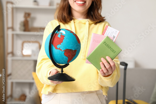 Female traveler with globe ...
