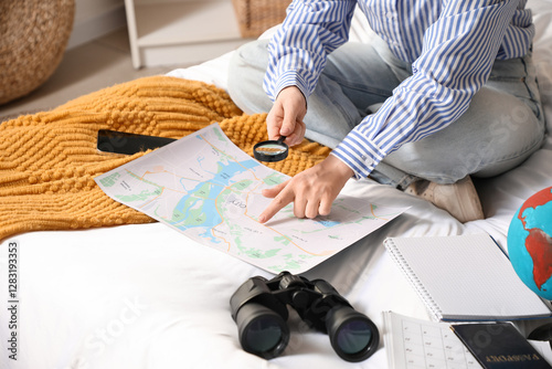 Female traveler with magnif...