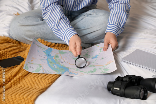 Female traveler with magnif...