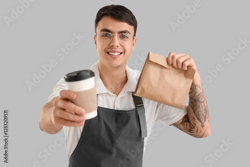 Male barista with cup of co...