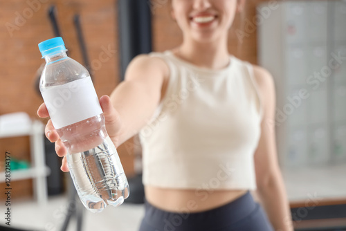 Sporty young woman with bot...