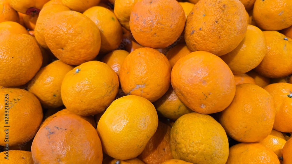 Fresh oranges with bright, juicy flesh, sliced and whole, arranged on a wooden surface. The citrus fruit is rich in vitamin C and antioxidants, perfect for healthy eating, refreshing drinks natural Fresh oranges with bright, juicy flesh, sliced and whole, arranged on a wooden surface. The citrus fruit is rich in vitamin C and antioxidants, perfect for healthy eating, refreshing drinks natural