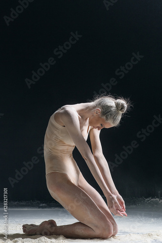Dancing in flour dancer posing on a studio background