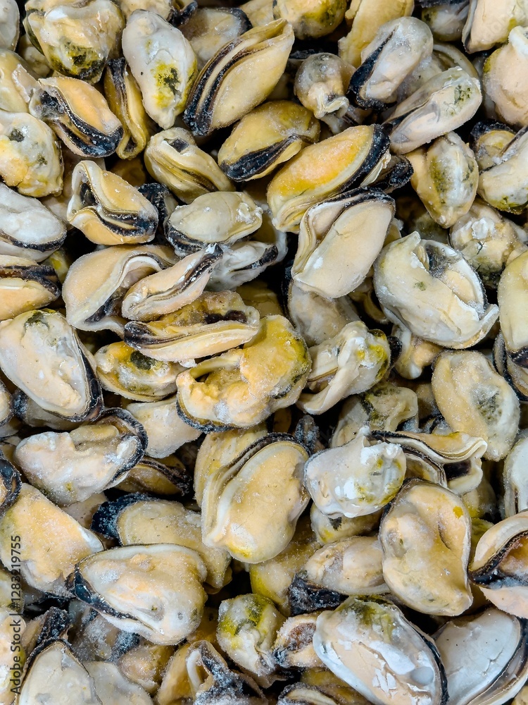 Freshly harvested shellfish displayed at a seafood market in a coastal region during daytime Freshly harvested shellfish displayed at a seafood market in a coastal region during daytime