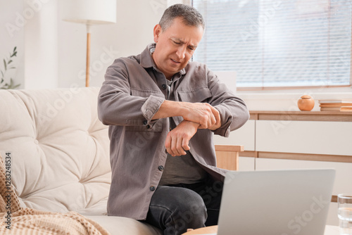 Mature man suffering from w...