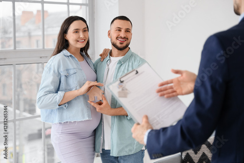 Young pregnant couple with ...