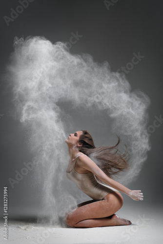 Plakat Dancing in flour dancer posing on a studio background