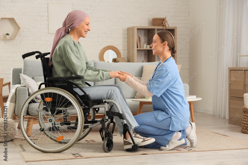 Mature woman after chemotherapy in wheelchair with nurse holding hands at home. Brain cancer concept Mature woman after chemotherapy in wheelchair with nurse holding hands at home. Brain cancer concept