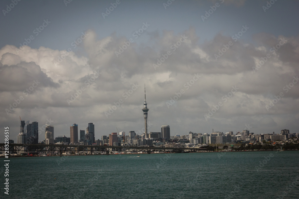 Naklejka premium Retro style photo of a view over Auckland Harbour and a skyline of Auckland City from a suburb of Birkinhead. North Island, New Zealand