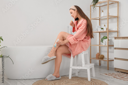 Hurrying young woman with t...