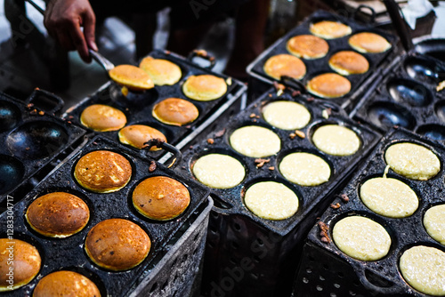 The process making Apem Cake or Kue Apem at Ngasem market (traditional market) in Yogyakarta, Indonesia. Kue Apem is traditional Javanese snacks made from rice flour. photo