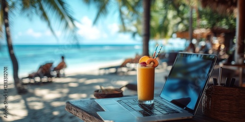 Fototapeta Naklejka Na Ścianę i Meble -  Freelancer working remotely on tropical beach with laptop and fruit juice
