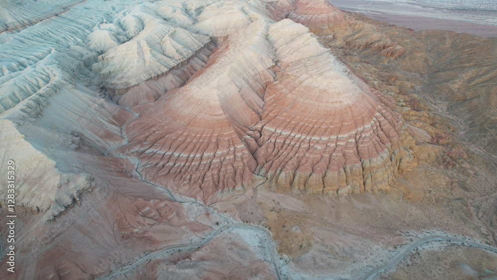 Stunning aerial perspective showcasing the vibrant hues and intricate patterns of the aktau mountains, highlighting the power of erosion and the beauty of natural landscapes