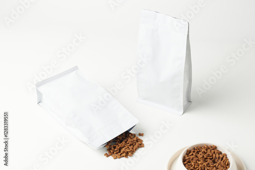 Clean and Minimalist Packaging Design of Pet Food Bags With Spilled Contents on a White Background