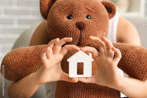 Girl with house figure and ...
