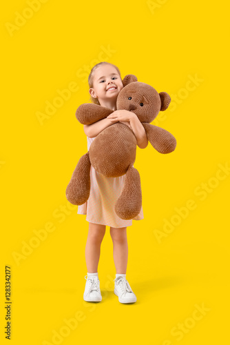Cute little girl hugging to...