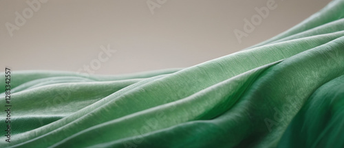 The elegant art of flowing green fabric.