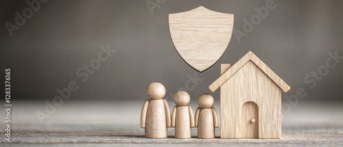 Family Happiness and Shield of Protection with Wooden Figures, house and shield concept