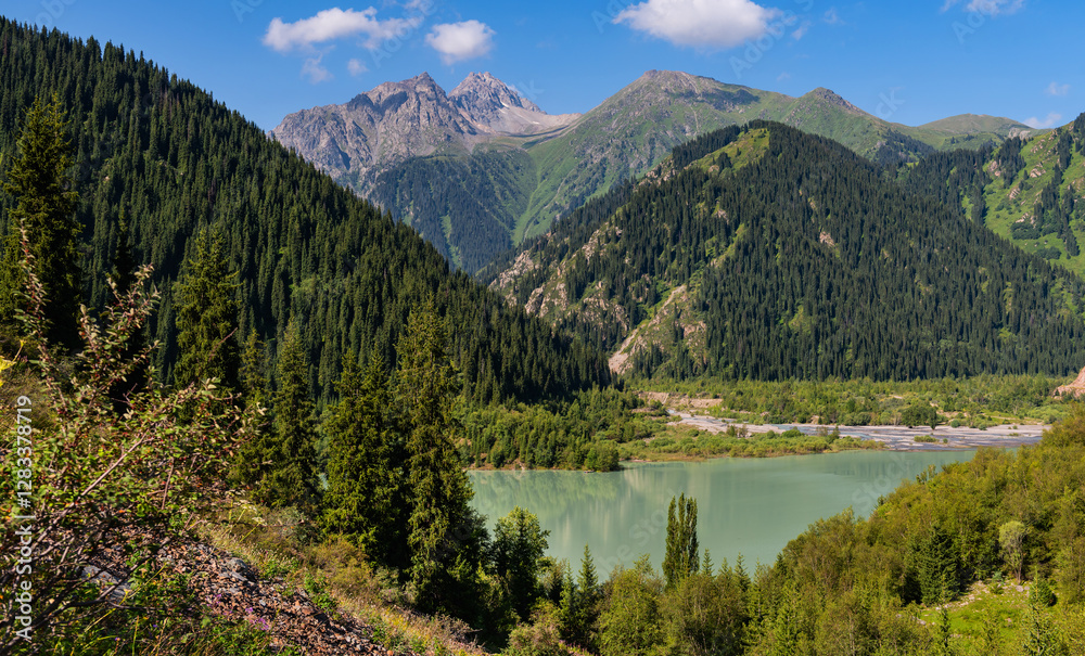 Picturesque mountain lake Issyk in the vicinity of the Kazakh city of Almaty on a summer day Picturesque mountain lake Issyk in the vicinity of the Kazakh city of Almaty on a summer day