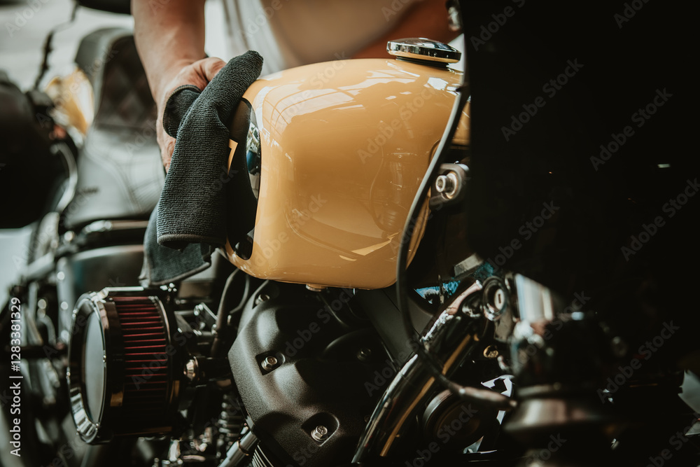 Biker man cleaning motorcycle , Polished and coating wax on fuel tank. repair and maintenance motorcycle concept.