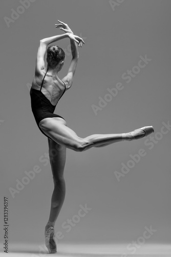 Bild auf Leinwand Young beautiful ballerina is posing in studio