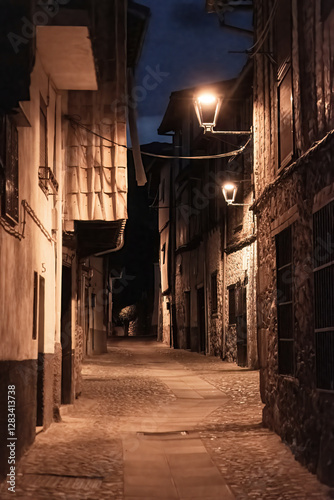 Beautiful nightfall view of a typical and narrow street in the Jewish Quarter of Hervás at night,  one of the best preserved in Spain, an Ambroz Valley village at Caceres, Extremadura, Spain. 
