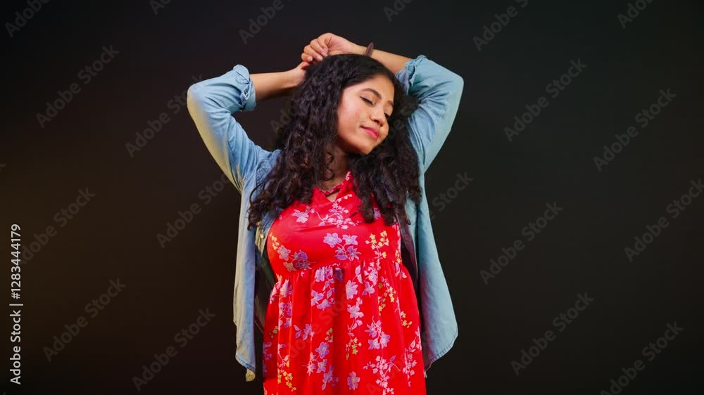 Woman Standing stretches arms upward eyes heavy