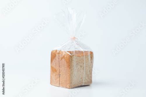 Freshly Packaged Sliced Bread in Transparent Plastic Bag on a Clean Surface