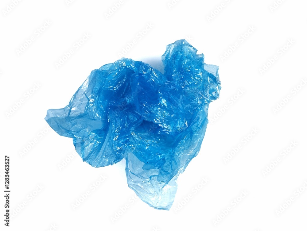 Fototapeta premium Blue crumpled plastic bag isolated on white background 