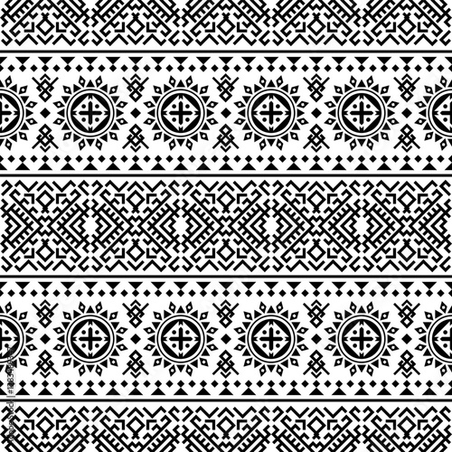 A striking seamless pattern featuring bold, repeating geometric shapes in black and white. Inspired by ancient tribal motifs, ideal for textiles, home decor, and digital designs.