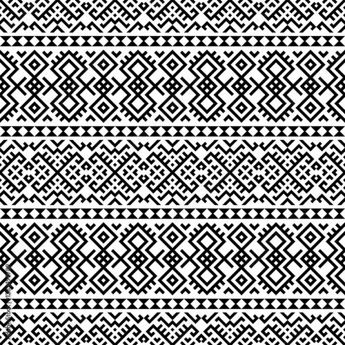 A striking horizontal seamless pattern with intricate tribal-inspired geometric designs in black and white. Great for branding, packaging, and home decor.
