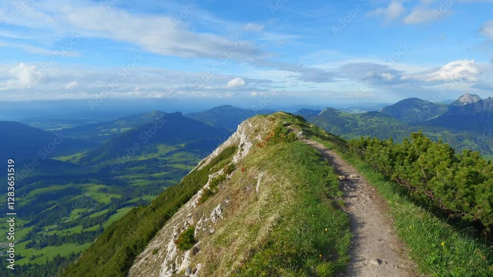 Tranquil Spring Hiking on Mountain Paths in Bad Hindelang, Bavaria - Experience the Majestic Beauty of the Allgäu Alps with Green Hills and Blue Skies Tranquil Spring Hiking on Mountain Paths in Bad Hindelang, Bavaria - Experience the Majestic Beauty of the Allgäu Alps with Green Hills and Blue Skies