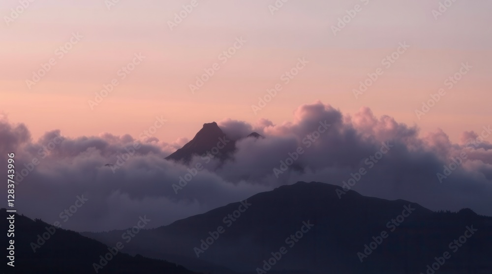 Obraz premium Mountain peaks rise above a blanket of fog under a soft, pastel sky at sunrise.