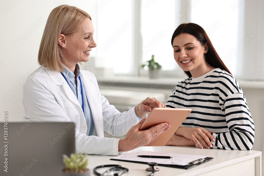 Woman having appointment with doctor in hospital Woman having appointment with doctor in hospital