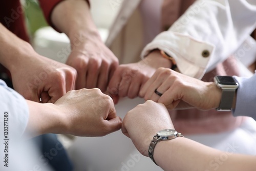 Wallpaper Mural Unity concept. People holding fists together indoors, closeup Torontodigital.ca