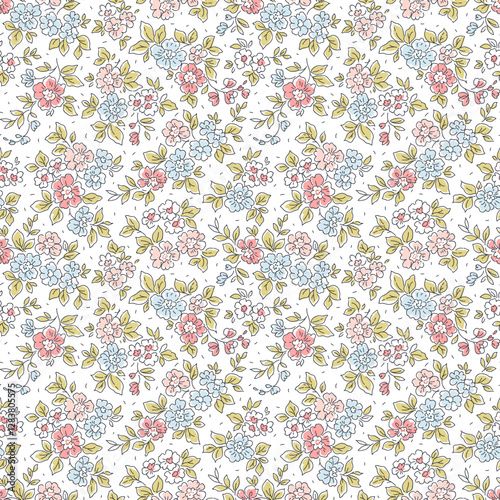 Vector seamless pattern. Vintage
pattern in small flowers. Small blue and
pink flowers. White background. Liberty
floral background. Trendy template for
fashion prints. Stock vector.